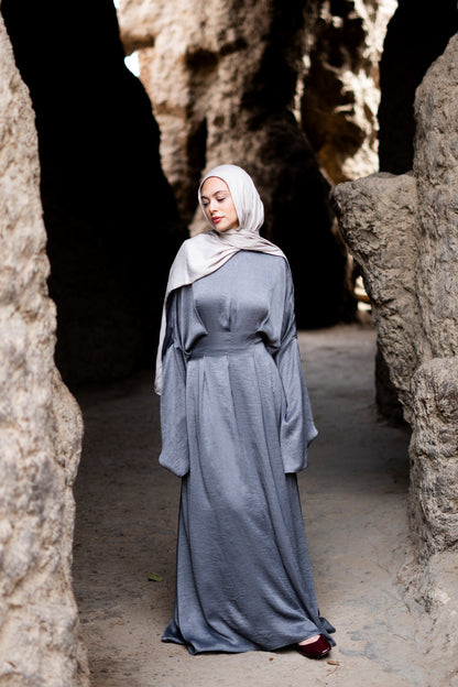 Elegant dress with a unique waist cut that creates a flattering, feminine silhouette.

Designed with a thin back belt for adjustable fitting.

Comes with a separate inner lining for extra comfort and coverage. Suitable for up to 90 kg.